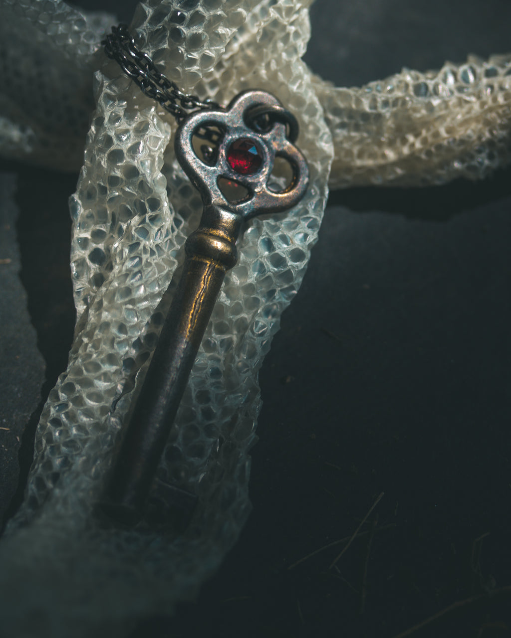 Hekate’s Crossroads Key with Almandine Garnet: A Symbol of Transformation, Passion, and the Power of Choice
