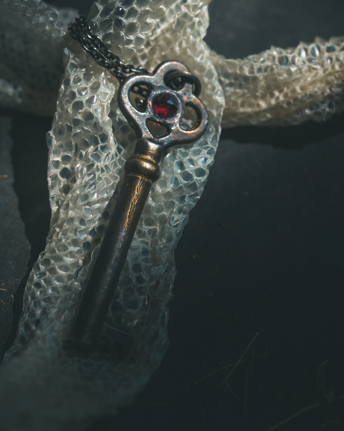 Hekate’s Crossroads Key with Almandine Garnet: A Symbol of Transformation, Passion, and the Power of Choice