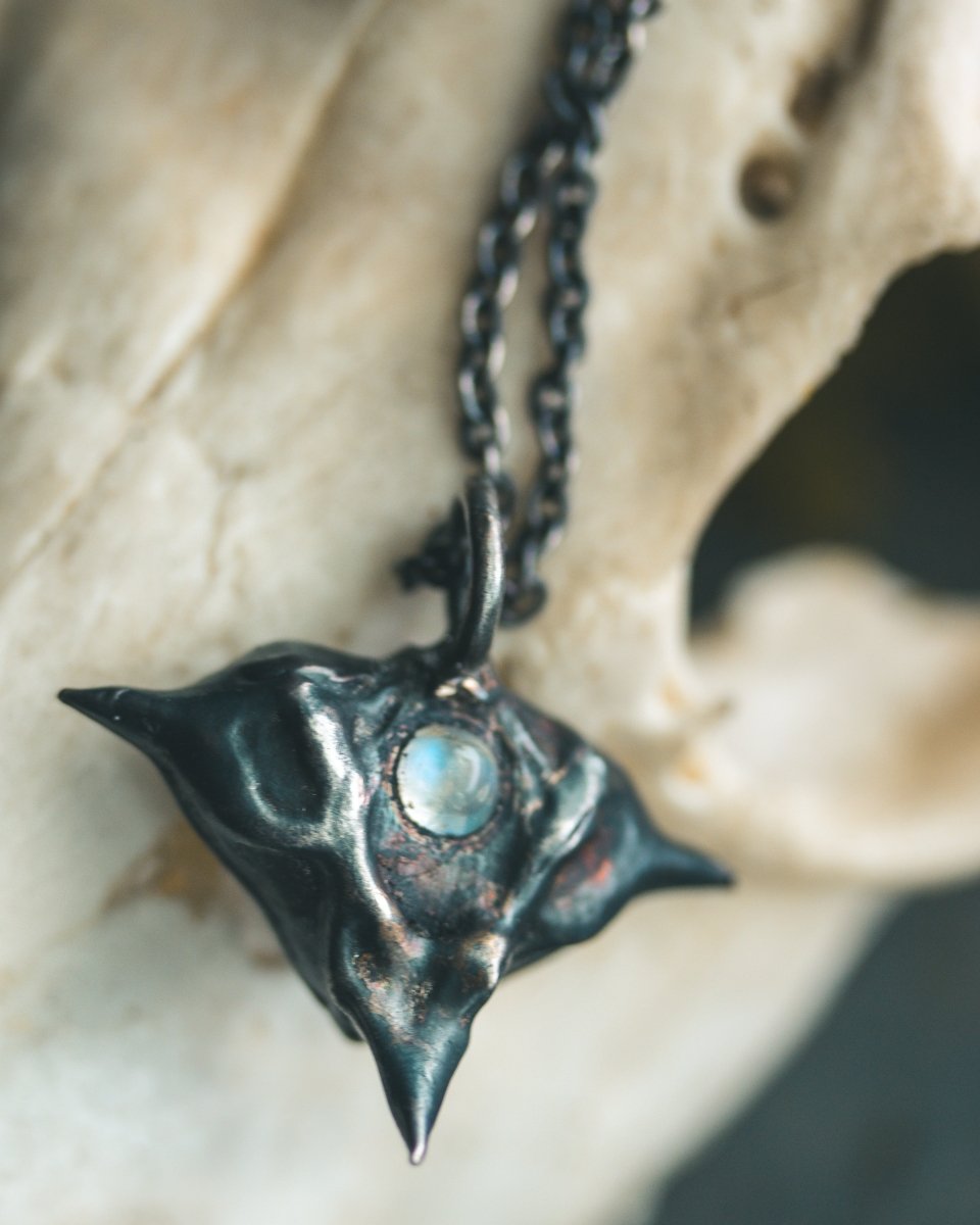 Devil Pods Charm with Moonstone: Handcrafted Silver Charm with 23.5K Gold Accents - Machinations