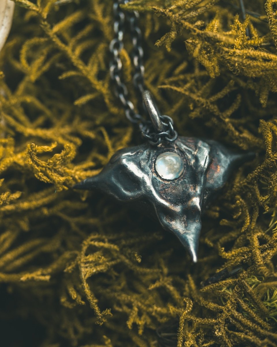 Devil Pods Charm with Moonstone: Handcrafted Silver Charm with 23.5K Gold Accents - Machinations