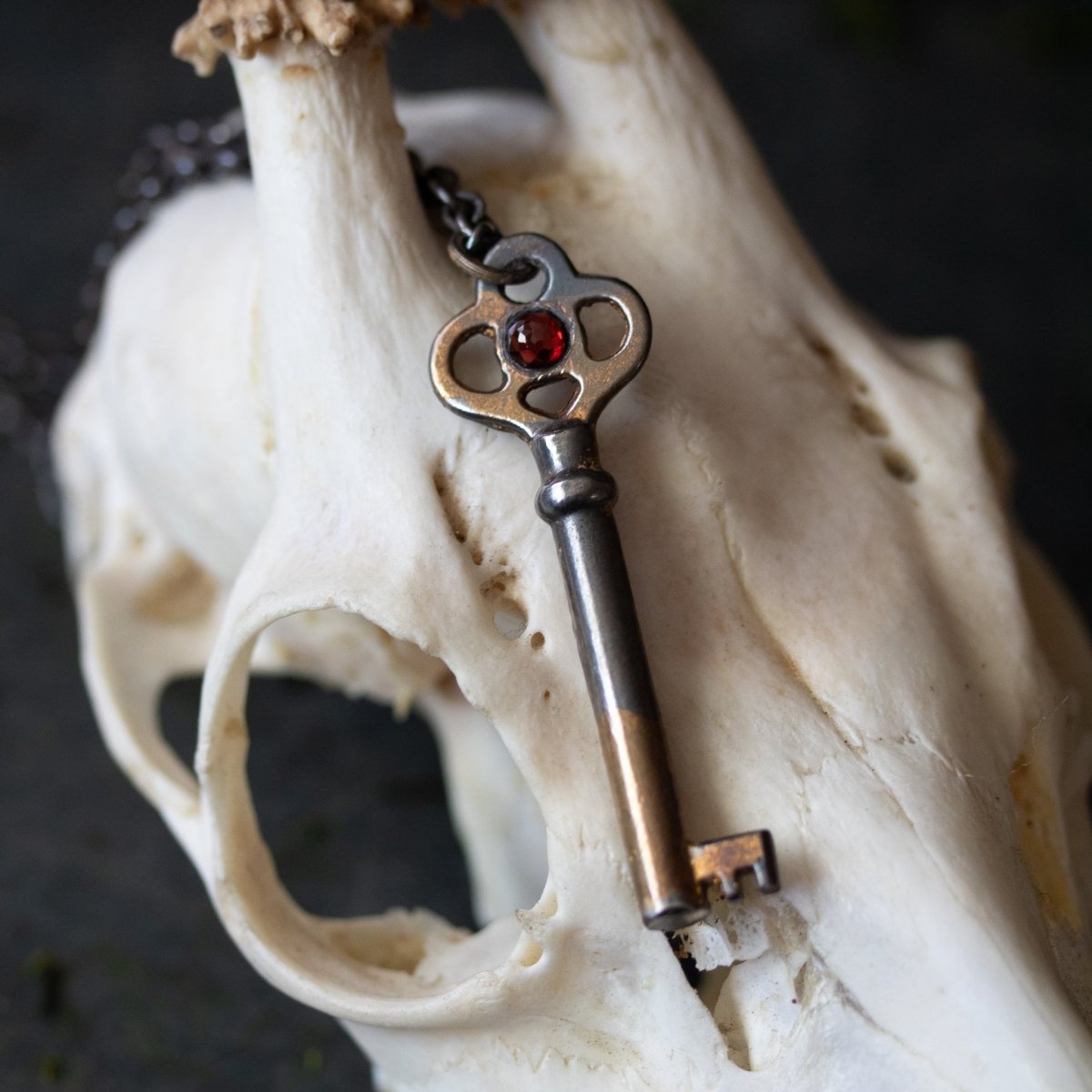 Hekate’s Crossroads Key with Almandine Garnet: A Symbol of Transformation, Passion, and the Power of Choice - Machinations