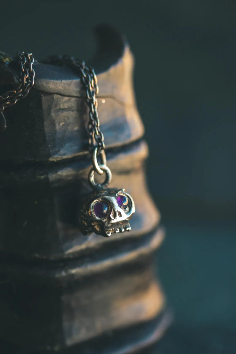 Memento Mori Skull Charm with Amethyst Eyes – Sterling Silver & 23.5K Gold | Talisman of Mortality, Intuition & Inner Strength - Machinations
