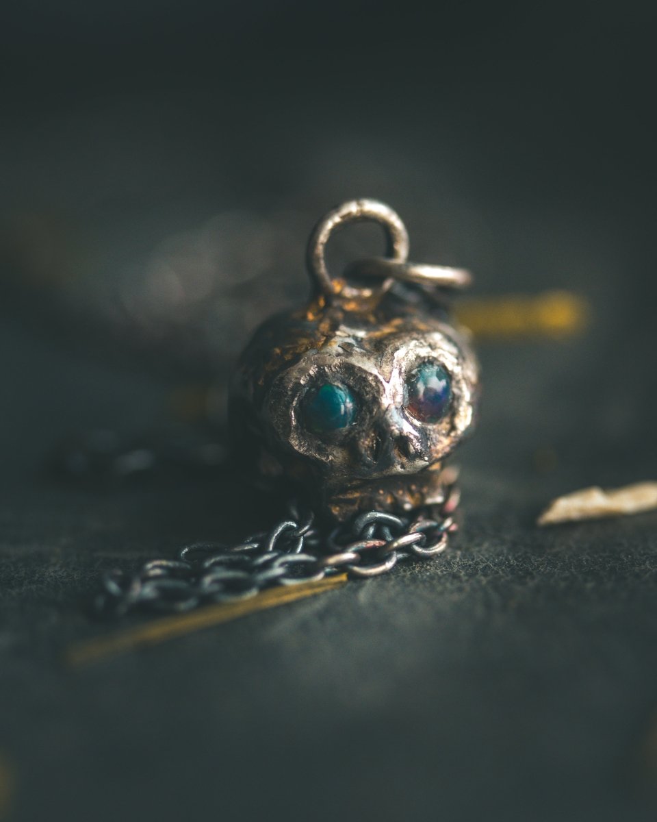 Memento Mori Skull Charm with Cabochon Black Opal – Sterling Silver & 23.5K Gold | Talisman of Life, Death and Cosmic Mystery - Machinations