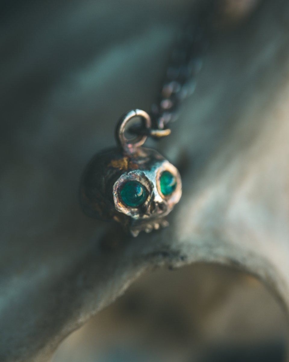 Memento Mori Skull Charm with Emerald Eyes – Sterling Silver & 23.5K Gold | Talisman of Life, Death, and Eternal Wisdom - Machinations
