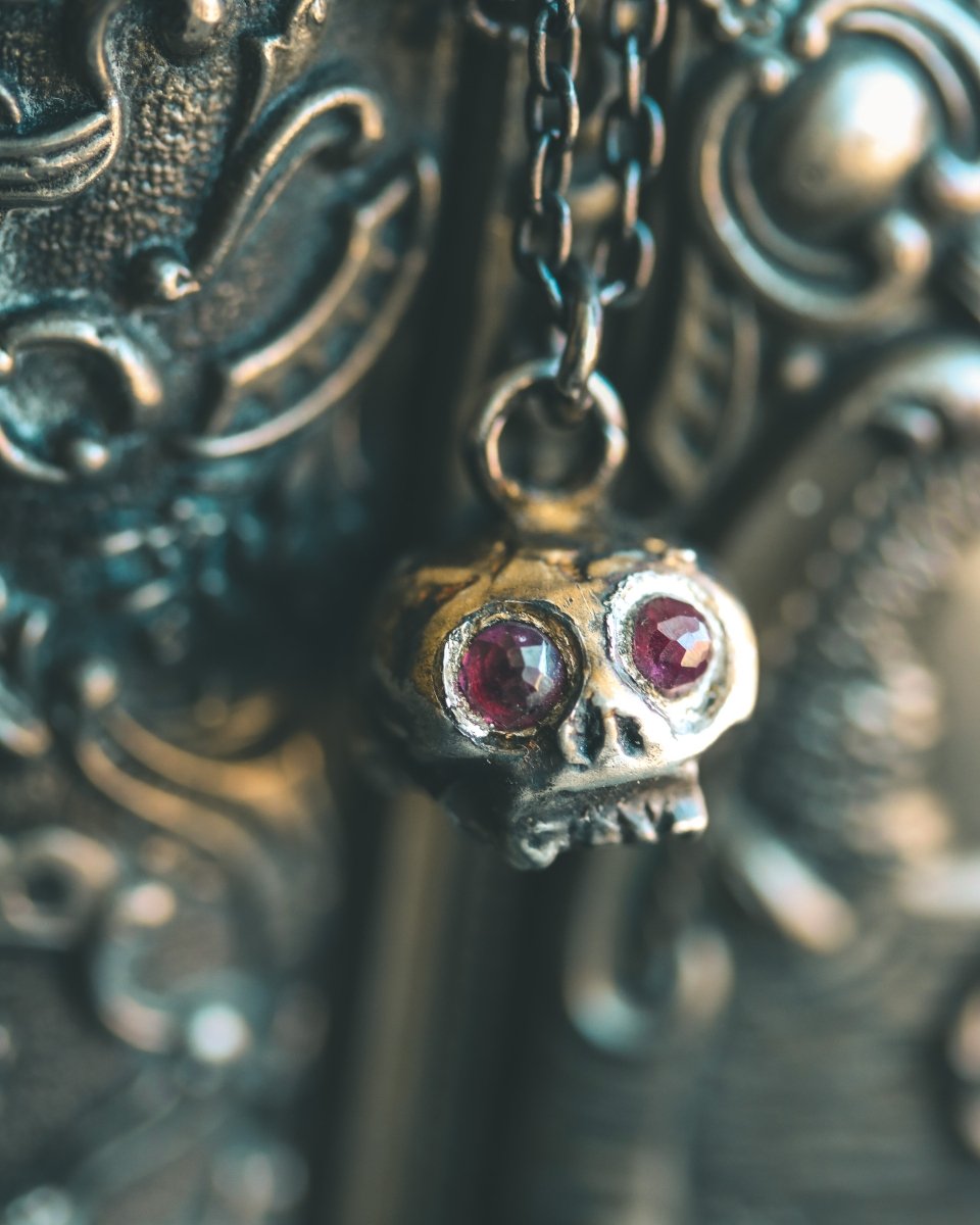 Memento Mori Skull Charm with Rose - Cut Rhodolite Garnet – Sterling Silver & 23.5K Gold | Symbol of Mortality, Strength and Passion - Machinations