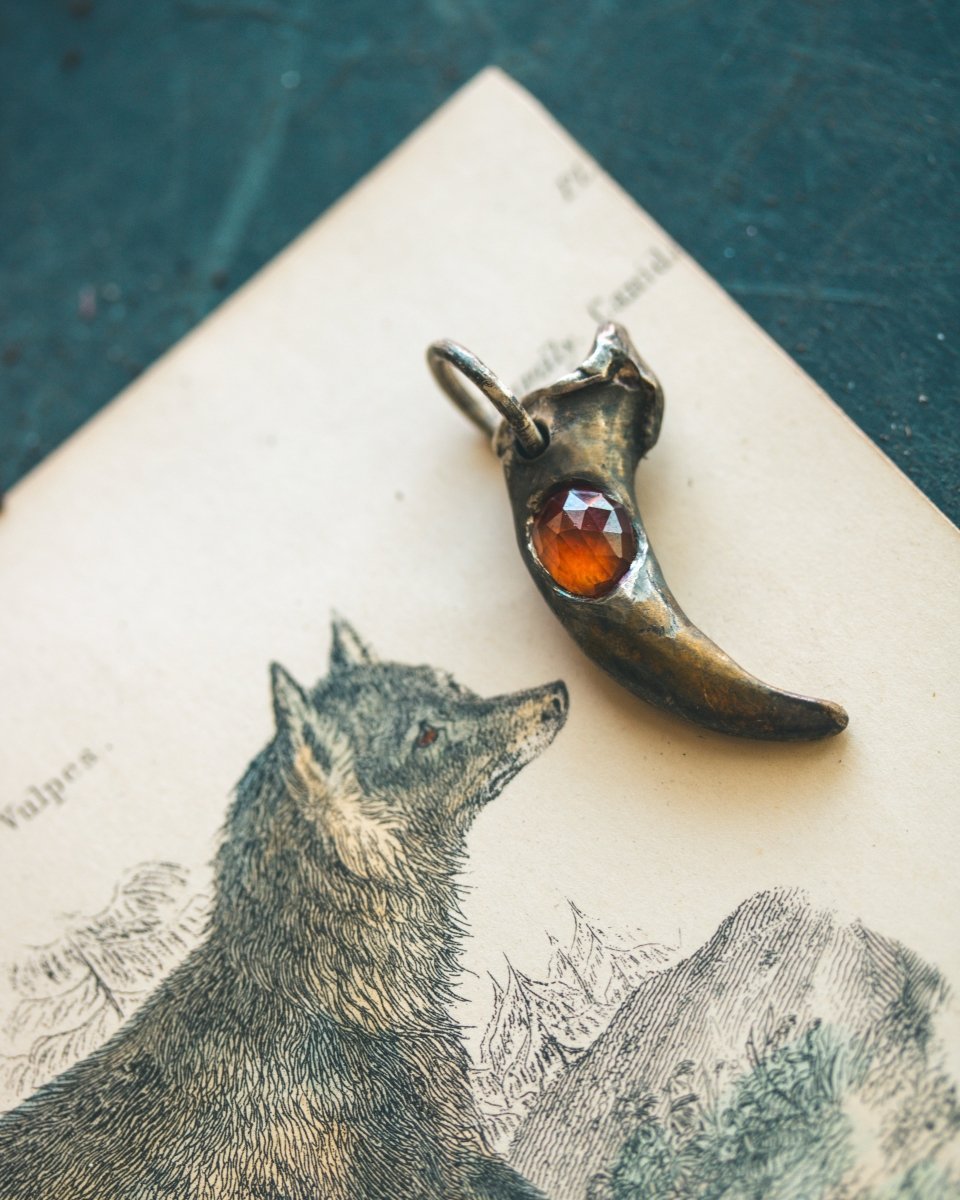 Wolf Claw Pendant with Hessonite Garnet: Symbol of Guardianship and Spiritual Transformation - Machinations