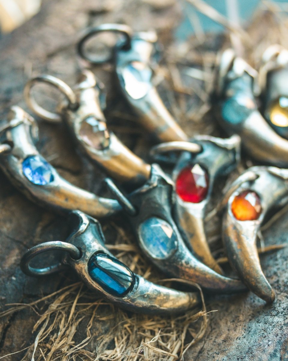 Wolf Claw Pendant with Hessonite Garnet: Symbol of Guardianship and Spiritual Transformation - Machinations