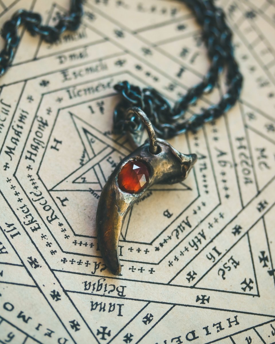 Wolf Claw Pendant with Hessonite Garnet: Symbol of Guardianship and Spiritual Transformation - Machinations