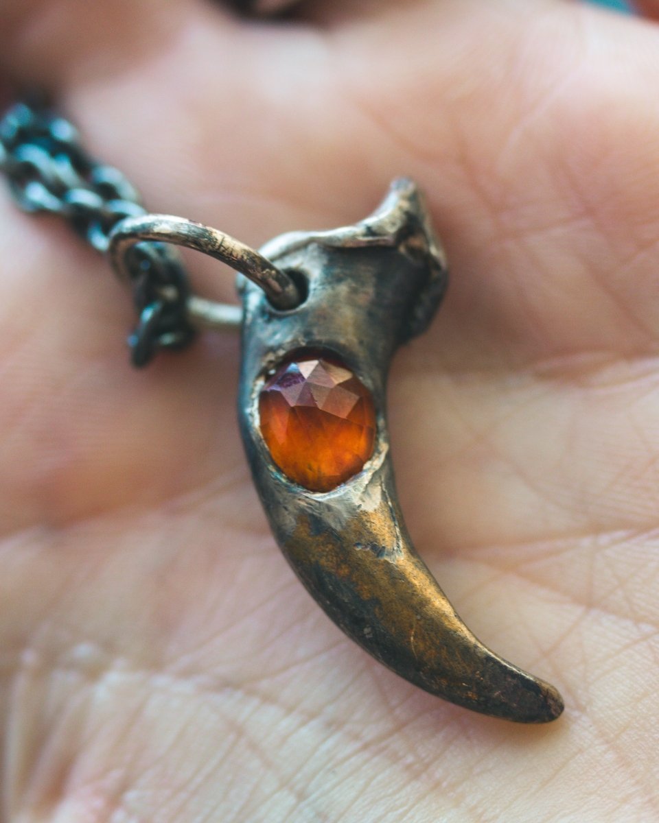 Wolf Claw Pendant with Hessonite Garnet: Symbol of Guardianship and Spiritual Transformation - Machinations