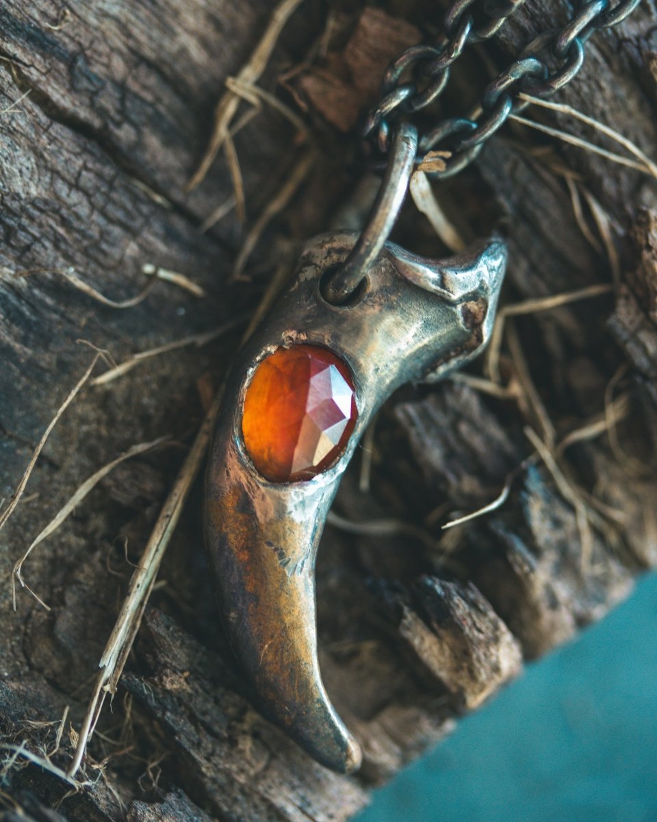 Wolf Claw Pendant with Hessonite Garnet: Symbol of Guardianship and Spiritual Transformation - Machinations
