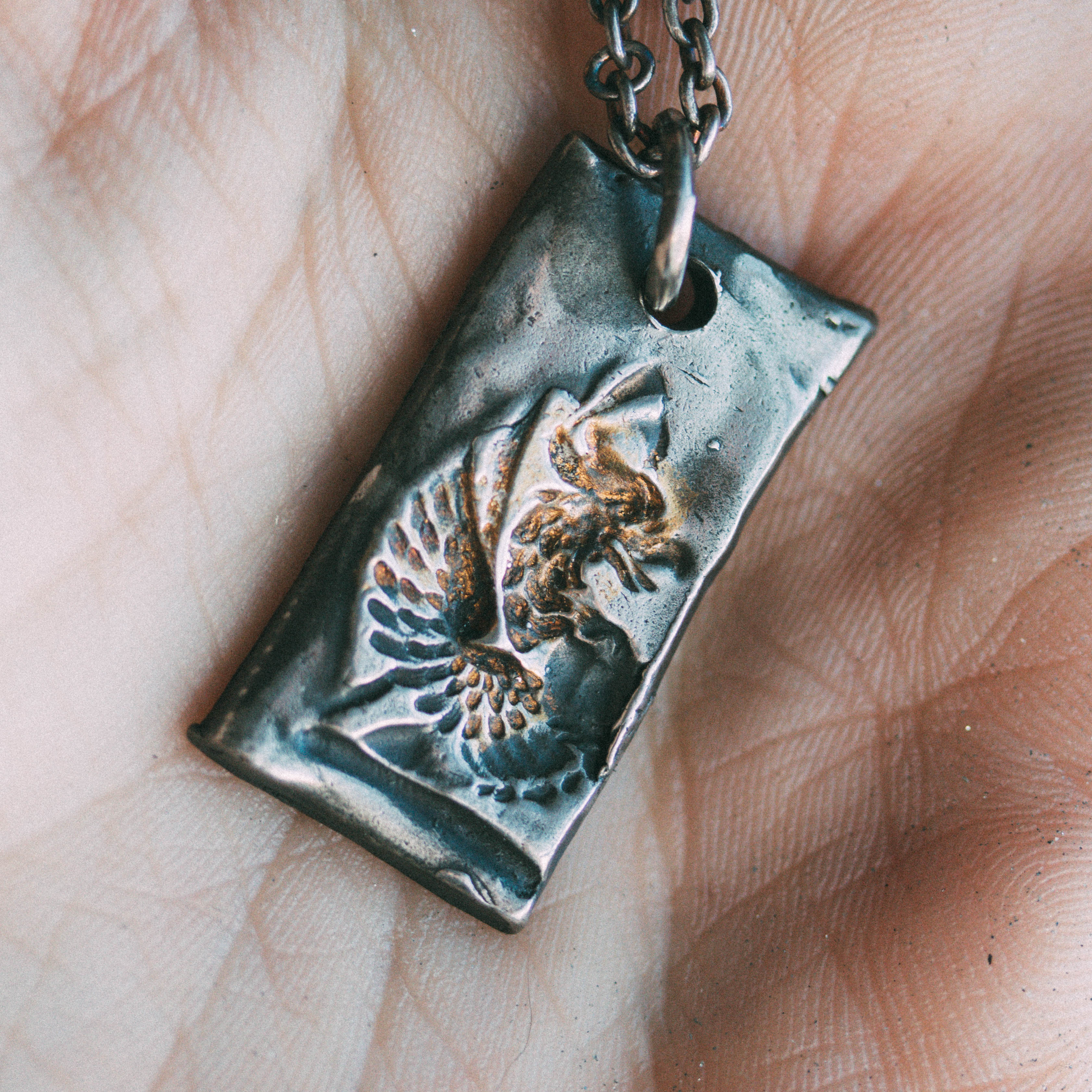 lluminated Griffin Tag in Sterling Silver and 23K Gold: A Symbol of Strength, Courage, and Protection